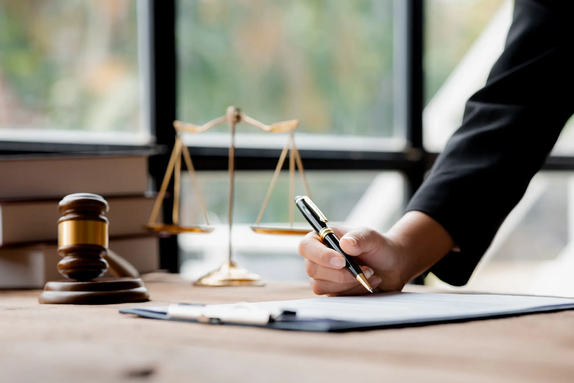 A lawyer sits a sign power of attorney