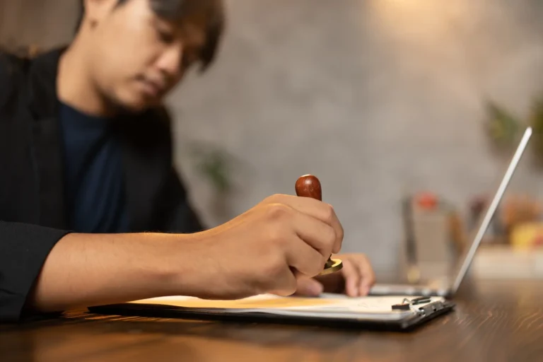 hand stamping with approved stamp on certificate document