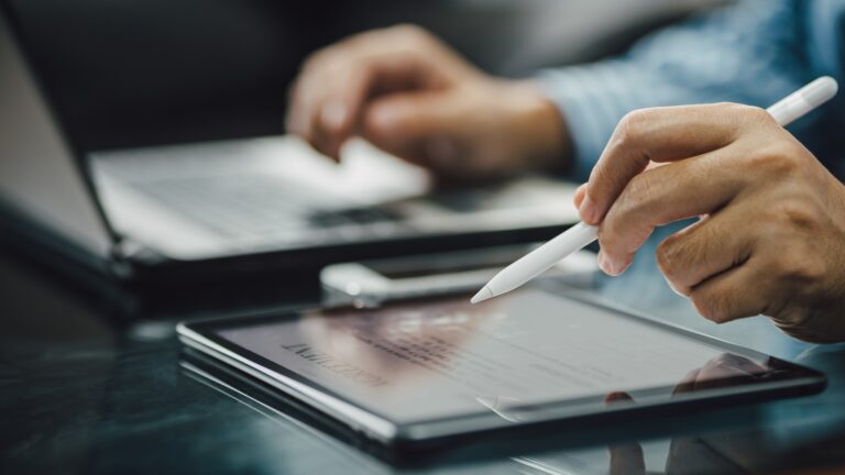 businessman hand signing agreement contract document electronic signature on digital tablet