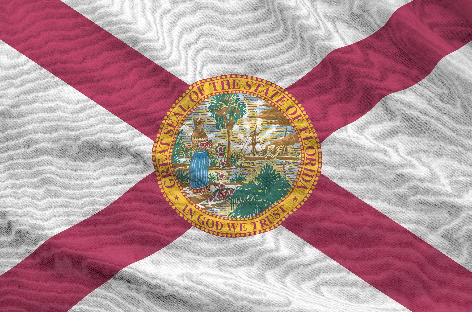 Florida US state flag depicted on folded wavy fabric of old cloth