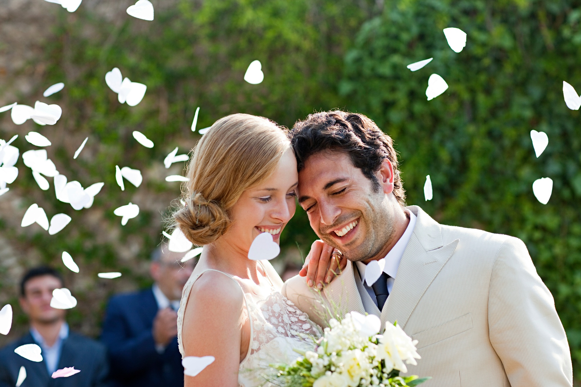 Newlyweds embracing at marriage ceremony